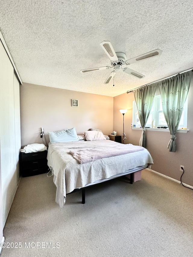 136 Windward Dr, Barnegat, NJ 08005 - carpeted bedroom featuring a textured ceiling, ceiling fan, and a closet