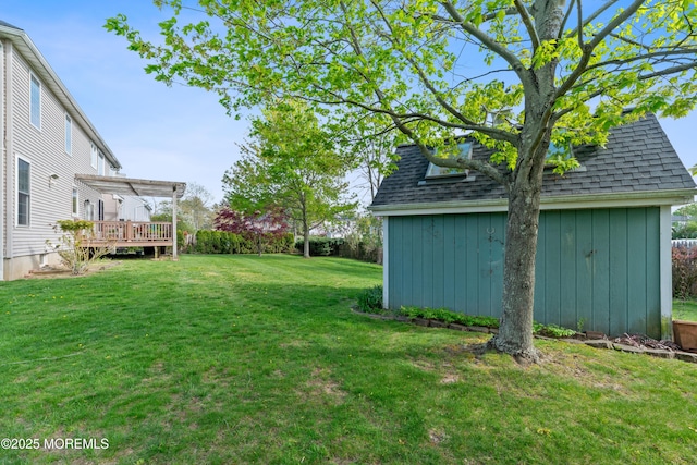 view of yard featuring a storage shed, an outdoor structure, a pergola, and a wooden deck