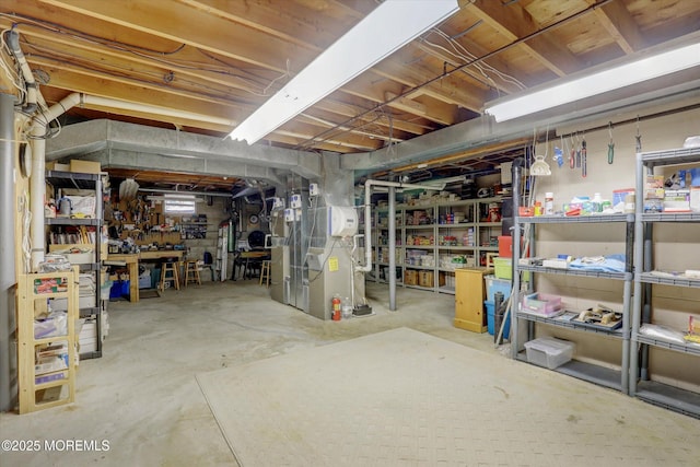 unfinished below grade area featuring heating unit and a workshop area