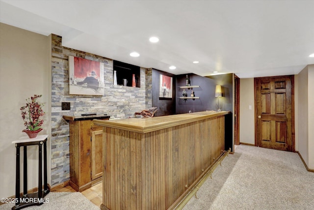 indoor wet bar with recessed lighting and baseboards