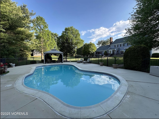 view of pool featuring a gazebo, fence, and a patio area