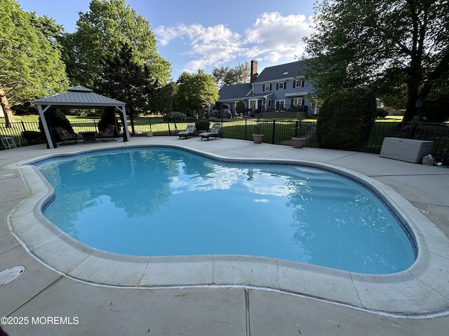 view of swimming pool featuring a gazebo, a patio, and a fenced backyard