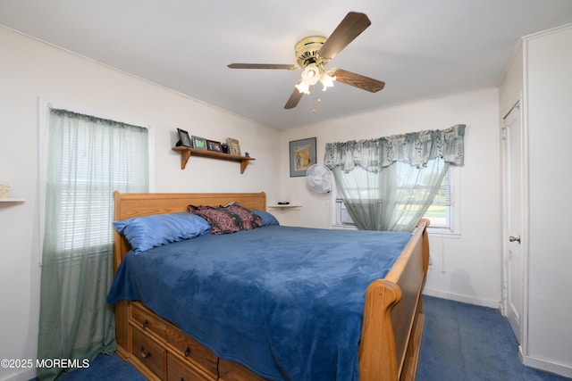 bedroom with baseboards, ceiling fan, and dark carpet