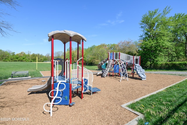 community playground featuring a yard