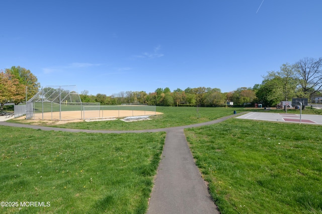view of community with fence and community basketball court