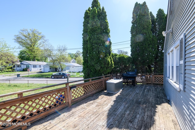 wooden deck featuring a residential view