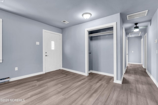 108 Manchester Ave, Forked River, NJ 08731 - foyer entrance with visible vents, a baseboard heating unit, baseboards, and wood finished floors