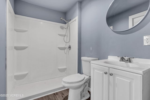 108 Manchester Ave, Forked River, NJ 08731 - full bathroom with vanity, walk in shower, toilet, and wood finished floors