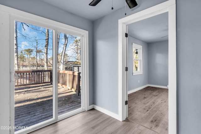 108 Manchester Ave, Forked River, NJ 08731 - doorway with a healthy amount of sunlight, baseboards, ceiling fan, and wood finished floors