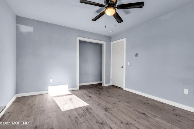 108 Manchester Ave, Forked River, NJ 08731 - unfurnished room featuring baseboards, ceiling fan, a baseboard heating unit, and wood finished floors