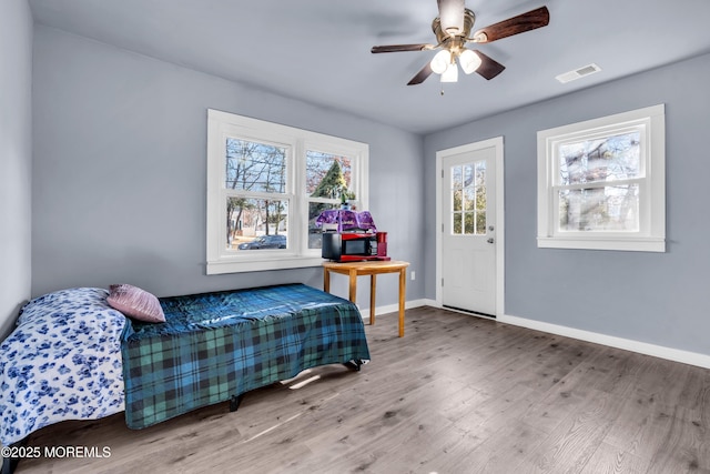 108 Manchester Ave, Forked River, NJ 08731 - bedroom featuring baseboards, ceiling fan, wood finished floors, and visible vents