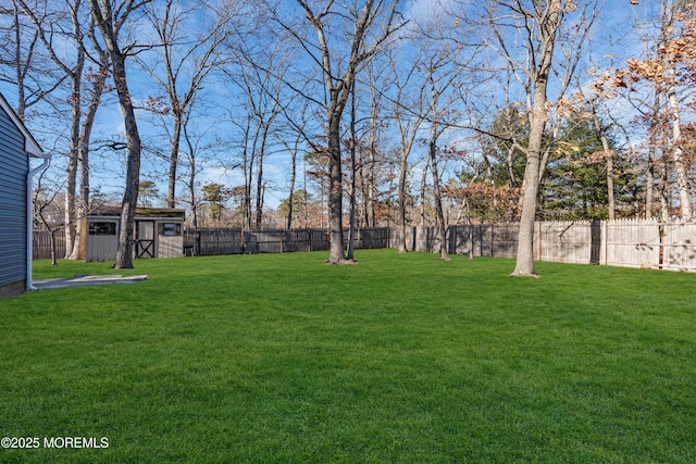108 Manchester Ave, Forked River, NJ 08731 - view of yard with a storage unit, a fenced backyard, and an outdoor structure