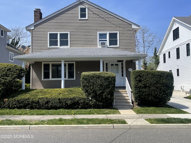 2015 5th Ave, Spring Lake, NJ 07762 - american foursquare style home with a porch, a chimney, and cooling unit