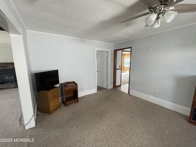2015 5th Ave, Spring Lake, NJ 07762 - unfurnished living room with carpet flooring, ceiling fan, a wood stove, a textured ceiling, and ornamental molding