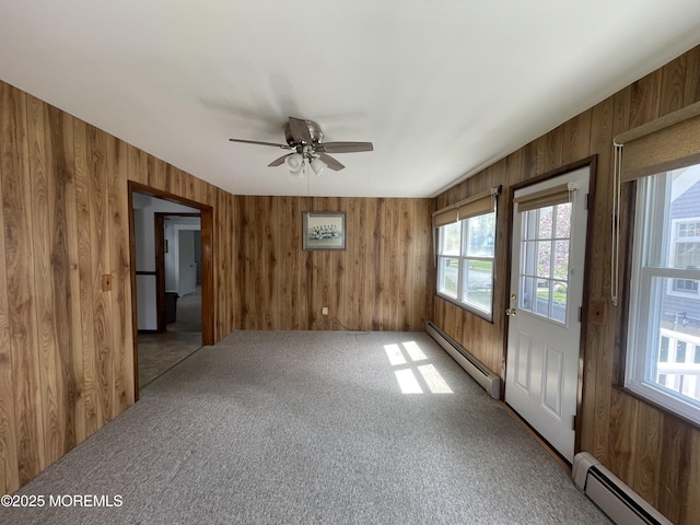 2015 5th Ave, Spring Lake, NJ 07762 - spare room featuring a baseboard heating unit, wooden walls, and a healthy amount of sunlight