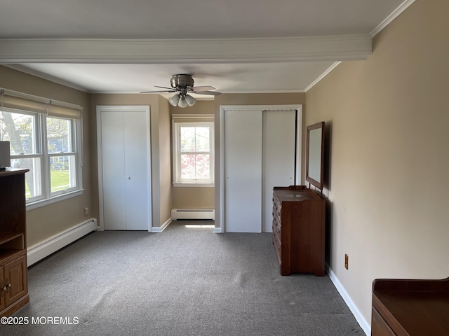 2015 5th Ave, Spring Lake, NJ 07762 - unfurnished bedroom with baseboard heating, carpet floors, multiple closets, a baseboard heating unit, and ornamental molding