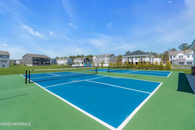 view of tennis court featuring a gazebo and a residential view