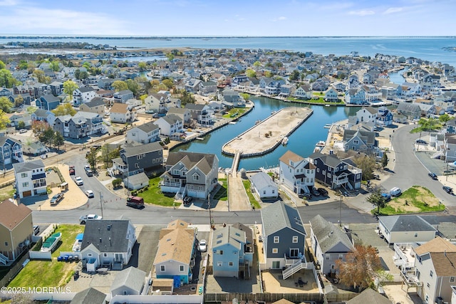 aerial view with a water view and a residential view
