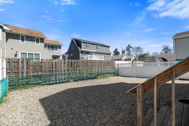 view of yard with a residential view and a fenced backyard