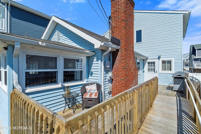 rear view of house featuring a chimney