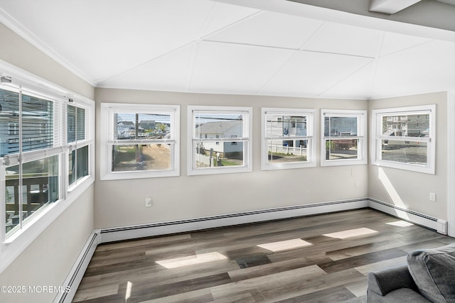 unfurnished sunroom featuring a baseboard radiator