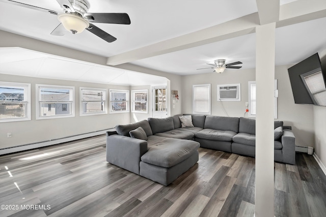 living room with wood finished floors, a ceiling fan, a wall unit AC, and a baseboard radiator