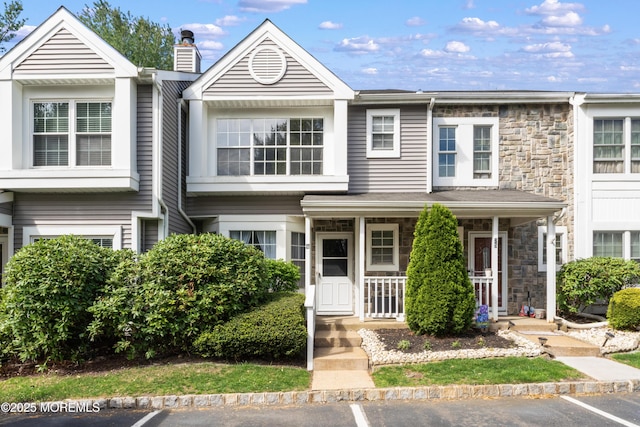 27 Mainbraid Ct, Tinton Falls, NJ 07753 - multi unit property featuring covered porch, uncovered parking, and stone siding