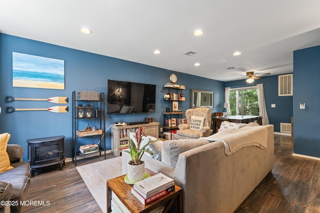 27 Mainbraid Ct, Tinton Falls, NJ 07753 - living area with visible vents, recessed lighting, dark wood finished floors, and a wood stove