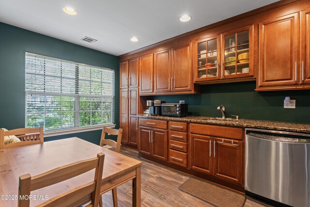 27 Mainbraid Ct, Tinton Falls, NJ 07753 - kitchen featuring a sink, dishwasher, visible vents, dark wood-style floors, and glass insert cabinets