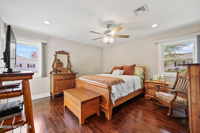 bedroom with dark wood-style flooring, ceiling fan, recessed lighting, baseboards, and visible vents