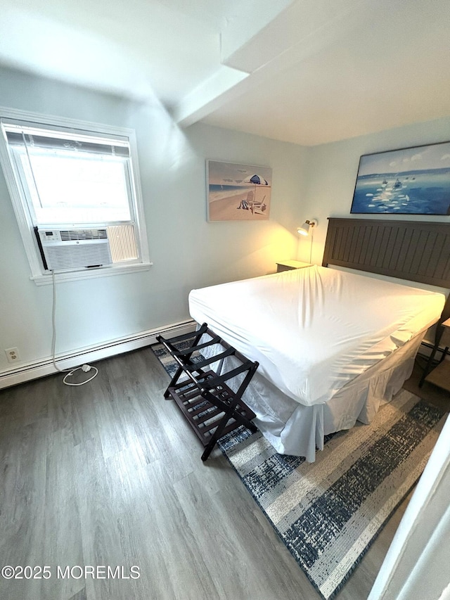 25 O St, Seaside Park, NJ 08752 - bedroom featuring wood finished floors, cooling unit, and a baseboard radiator