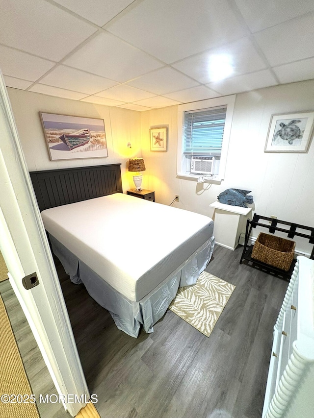 25 O St, Seaside Park, NJ 08752 - bedroom featuring a paneled ceiling, cooling unit, and wood finished floors