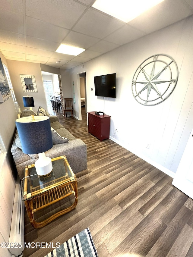 25 O St, Seaside Park, NJ 08752 - living room featuring wood finished floors and a paneled ceiling