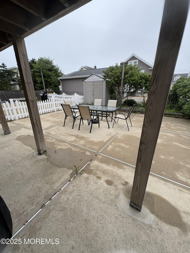 25 O St, Seaside Park, NJ 08752 - view of patio with a storage shed and outdoor dining space