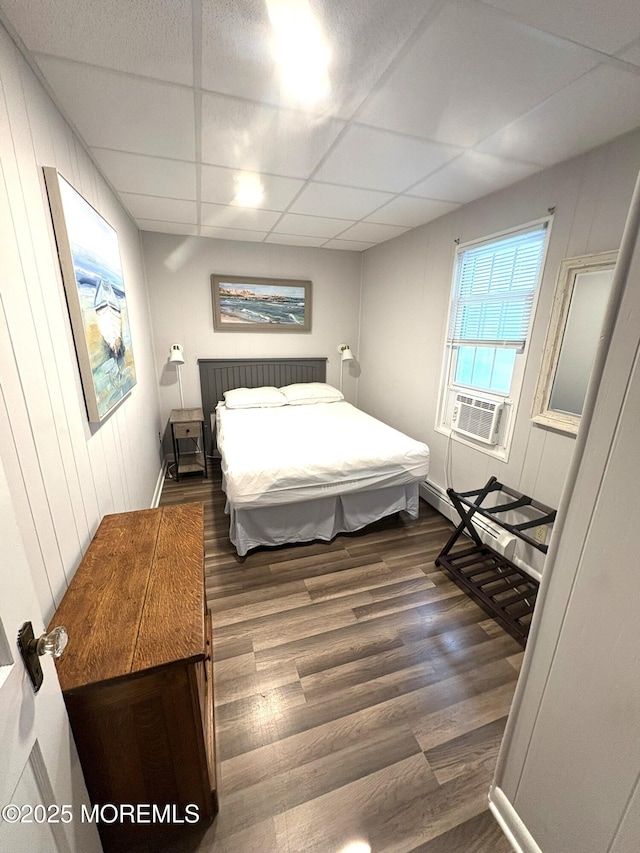 25 O St, Seaside Park, NJ 08752 - bedroom featuring wood finished floors, cooling unit, and a drop ceiling