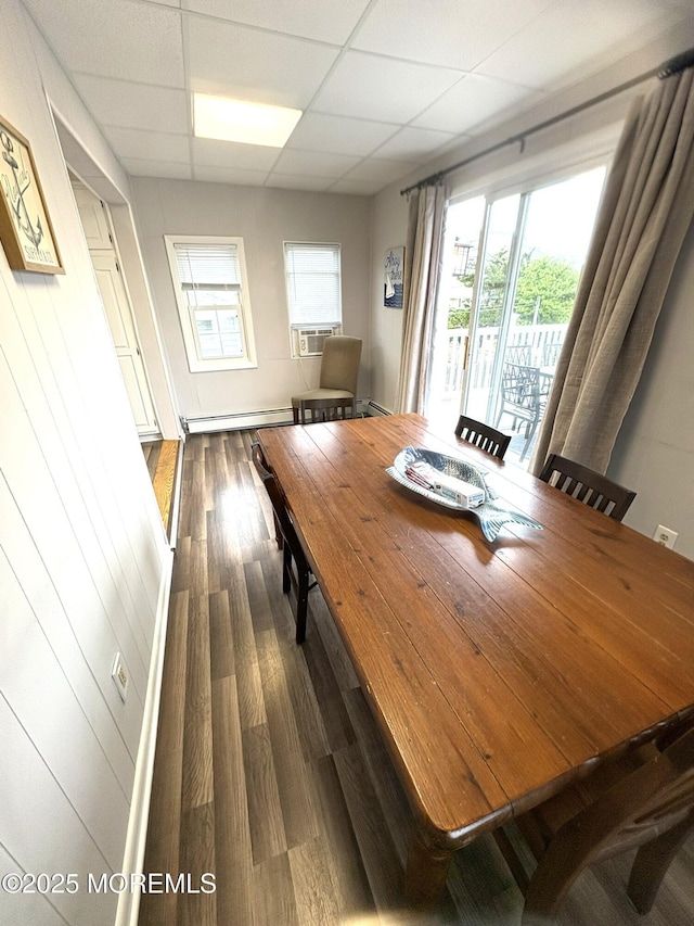 25 O St, Seaside Park, NJ 08752 - dining area with dark wood-style flooring, a paneled ceiling, a baseboard radiator, and cooling unit