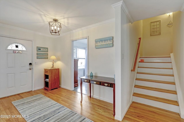 205 Arnold Ave, Point Pleasant Beach, NJ 08742 - foyer featuring a chandelier, stairway, healthy amount of natural light, wood finished floors, and ornamental molding