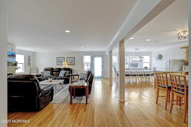 205 Arnold Ave, Point Pleasant Beach, NJ 08742 - living room with crown molding, plenty of natural light, light wood-style flooring, recessed lighting, and a chandelier