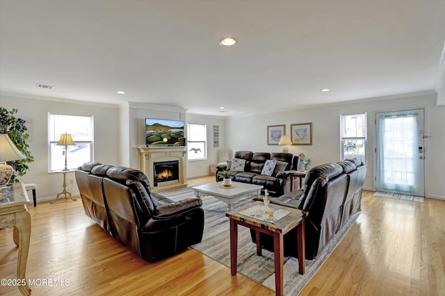 205 Arnold Ave, Point Pleasant Beach, NJ 08742 - living room featuring a lit fireplace, ornamental molding, light wood-style flooring, baseboards, and recessed lighting
