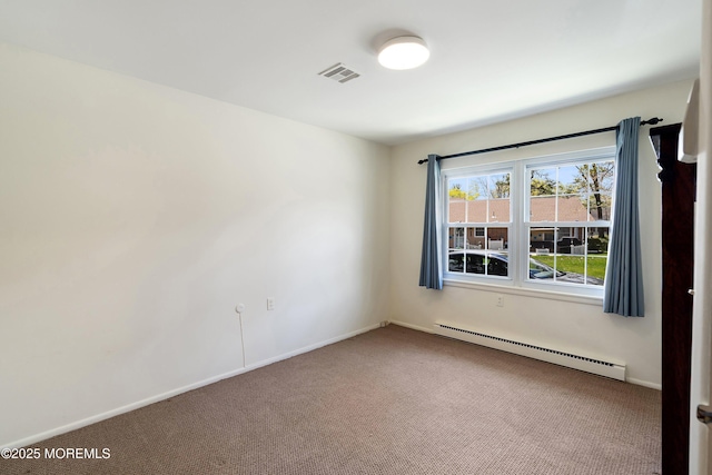 carpeted spare room with baseboards, a baseboard radiator, and visible vents