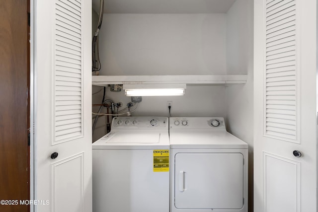 clothes washing area with laundry area and independent washer and dryer