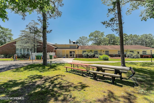 view of property's community with a yard
