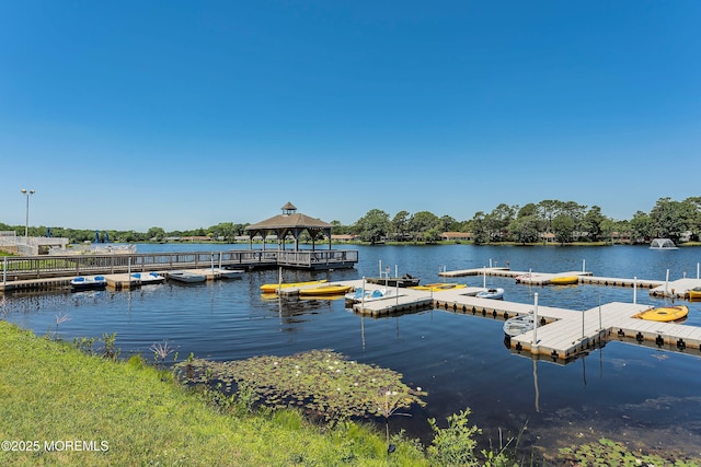 dock area with a water view and a gazebo