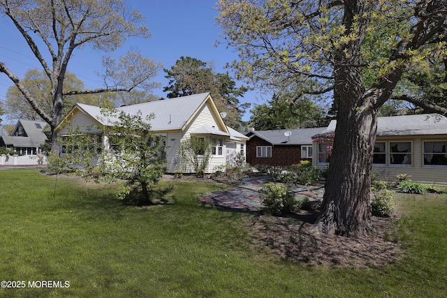 view of home's exterior with a lawn