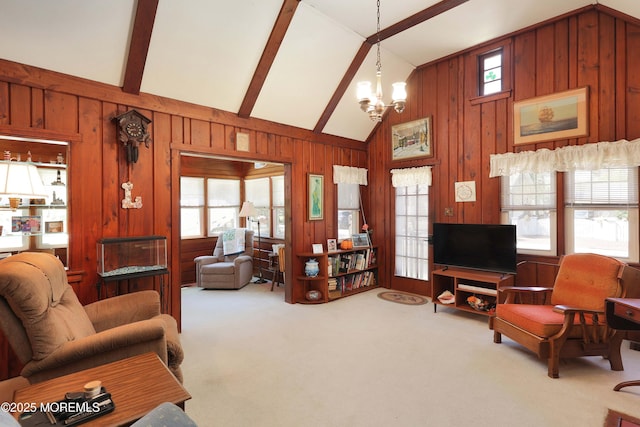 living area featuring plenty of natural light, carpet floors, vaulted ceiling with beams, and a notable chandelier