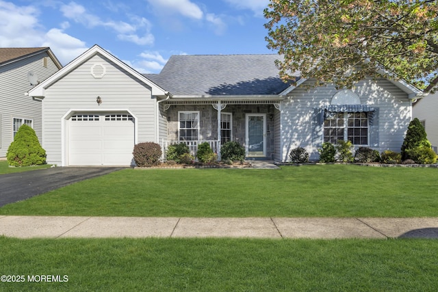view of front of home with covered porch, a front yard, roof with shingles, an attached garage, and driveway