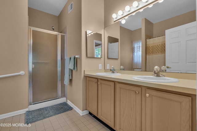 full bathroom featuring double vanity, visible vents, a shower stall, and a sink