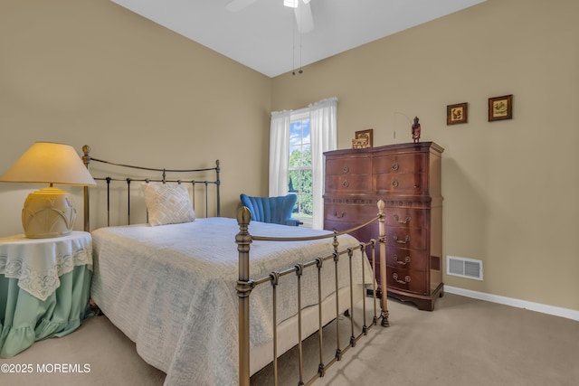 carpeted bedroom featuring baseboards, a ceiling fan, and visible vents