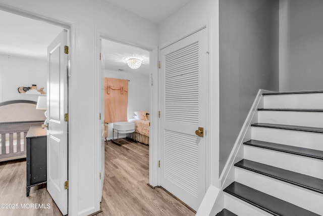 stairway featuring wood finished floors