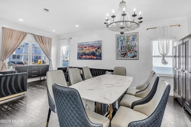 dining room with crown molding, recessed lighting, a notable chandelier, and wood finished floors